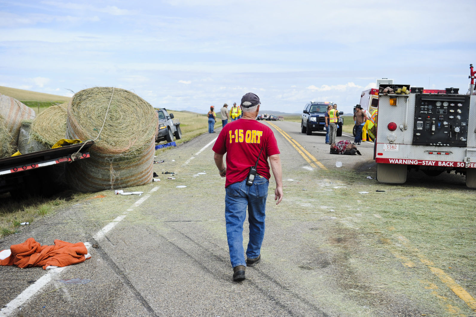 A volunteer paramedic surveys the scene